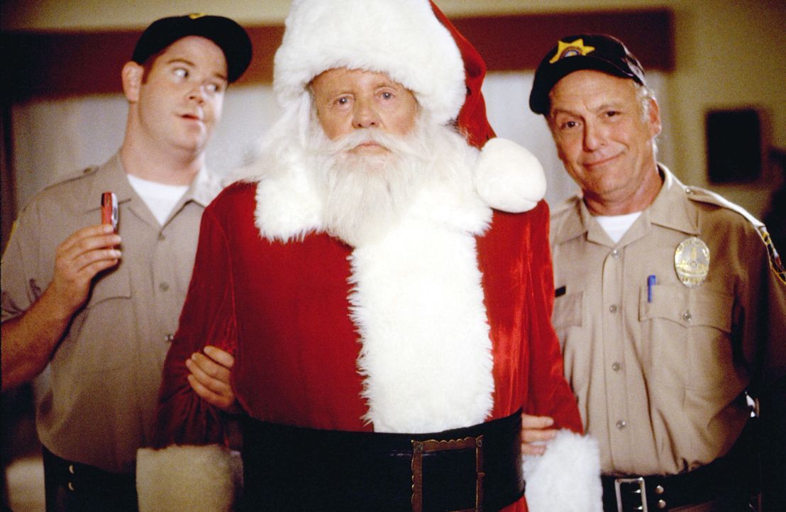 Officer Bobby Buckley (Sonny Carl Davis, r.) und Officer Calhoun (Steve Monroe, l.) nehmen am Weihnachtsabend den Nikolaus (Dick Van Patten, M.) gef... - Bildquelle: Tag Entertainment