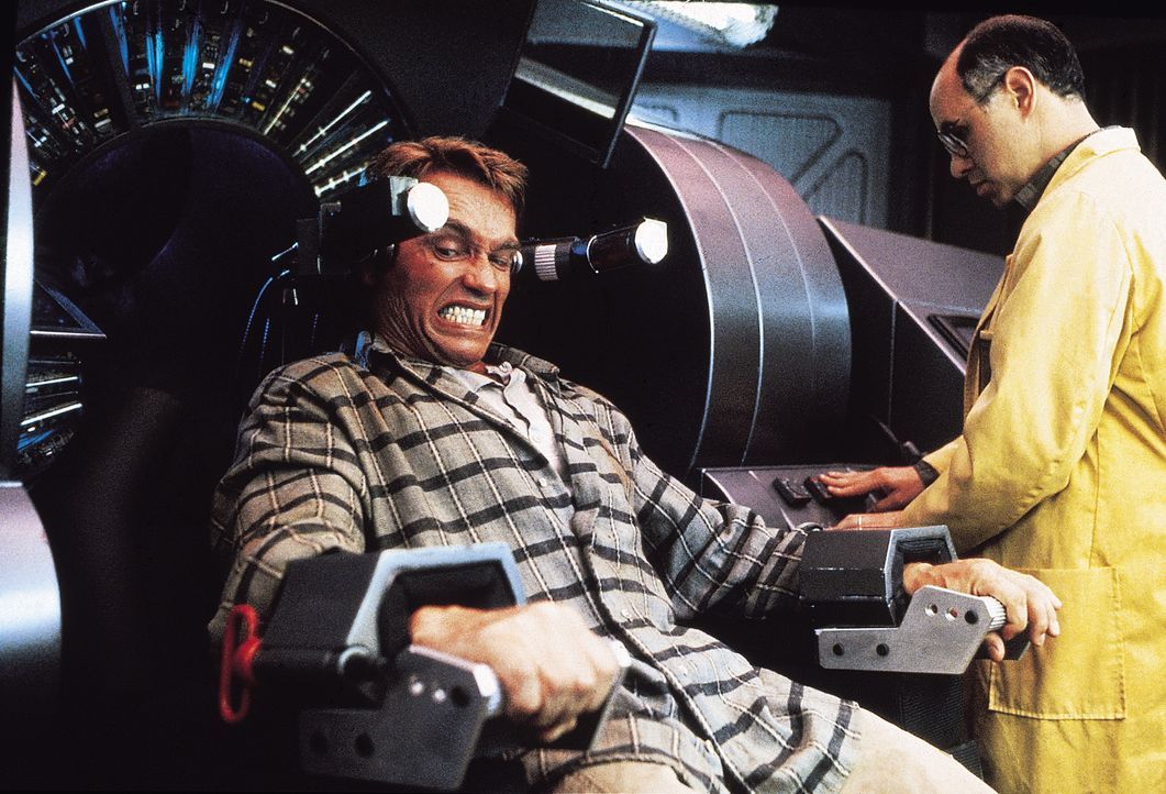 Immer wieder träumt Douglas (Arnold Schwarzenegger, l.) davon, ein Leben auf dem Mars zu führen. Als er dann eines Tages in der Firma "RECALL Inc."... - Bildquelle: 1990 STUDIOCANAL. All Rights Reserved.